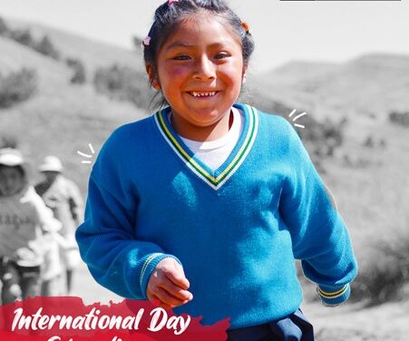 Girl in a blue school uniform with text International Day of Education and UNESCO logo