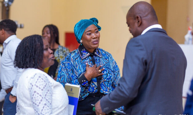 African education researchers networking at a conference.