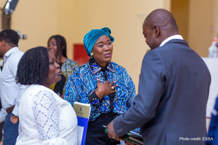 African education researchers networking at a conference.