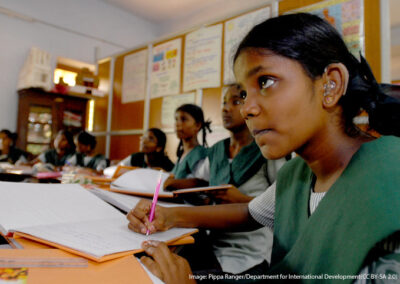 Girls in a classroom in Chennai, India, learning about global issues.