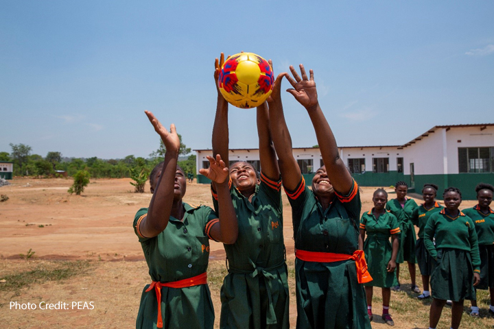 Adolescent girl pupils play dodgeball at the PEAS Kabuta Secondary School, supported by the Costa Foundation, Zambia. 