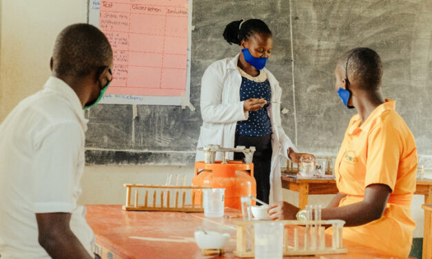 Female teacher giving a science class in a PEAS school, Uganda.