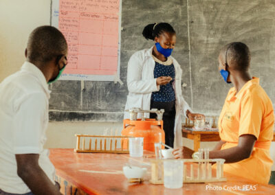 Female teacher giving a science class in a PEAS school, Uganda.