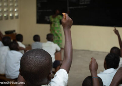 Children raise their hands as teacher Amunazo Belinda gives a lesson at Manua school near Kindu, Maniema province, Democratic Republic of Congo.