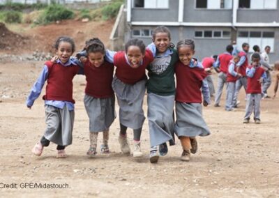 Five girls play together in a primary school playground, Ethiopia.