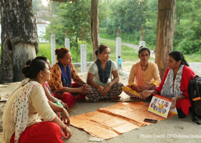 Women gather in a community group to learn about travelling abroad safely. The UK Aid funded Work in Freedom programme works in Nepal, Bangladesh and India to empower women to make the right decision, helping them to avoid exploitation if they decide to go abroad, and assisting them find work locally if they decide not to go. A group of women sitting on the ground in a circle