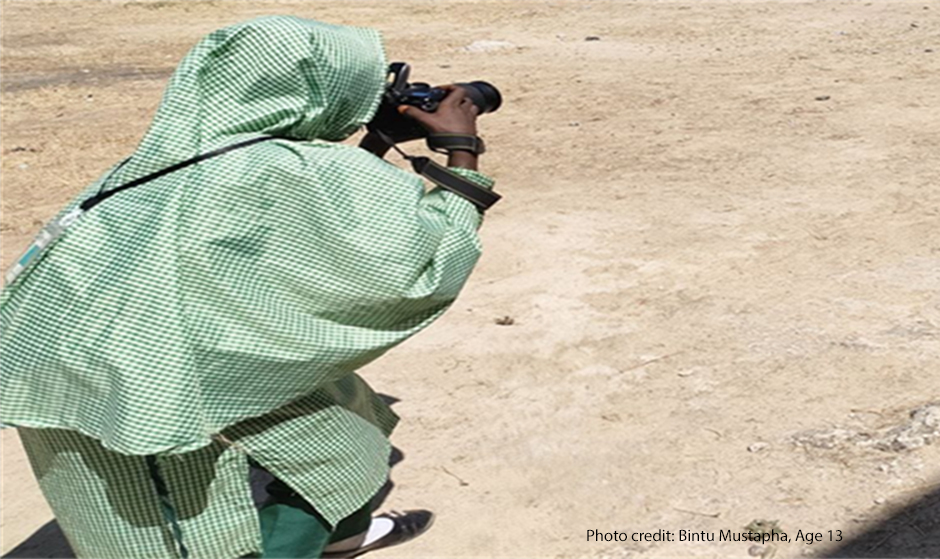 Young girl takes photos of her daily life for a photovoice project, Lake Chad region.