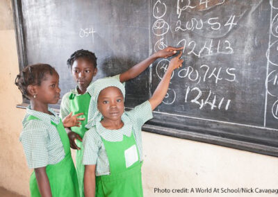 Three girl students at the blackboard in Kuje primary school in Abuja, Nigeria