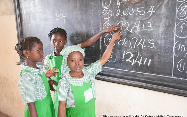 Three girl students at the blackboard in Kuje primary school in Abuja, Nigeria