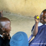 Irene, a pupil at one of the project schools, interacts with other children in her class
