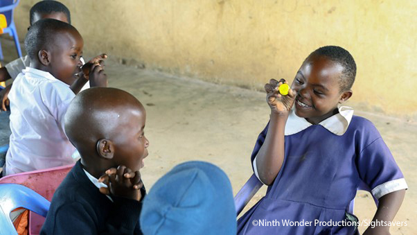 Irene, a pupil at one of the project schools, interacts with other children in her class