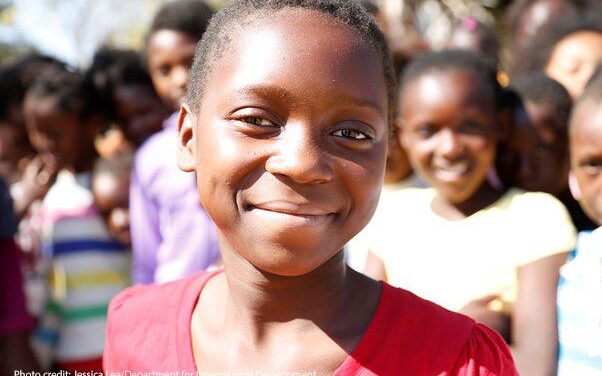 Twelve-year-old Suria smiles directly at the camera. The Adolescent Girls Empowerment Program – led by the Population Council – is currently helping more than 10,000 girls like Suria benefit from safe spaces in Zambia.