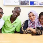 Four young people receiving business skill training, MEWA Centre, Mombasa, Kenya.