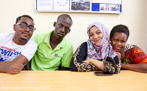 Four young people receiving business skill training, MEWA Centre, Mombasa, Kenya.