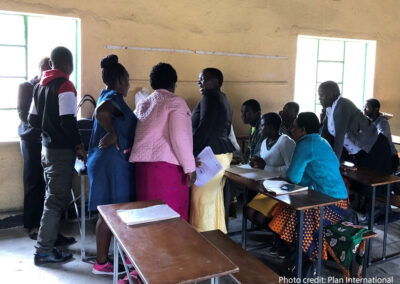 Community educators supported by school buddies engaged in an inter-hub reflection meeting. Matanda, Zimbabwe, 2022.