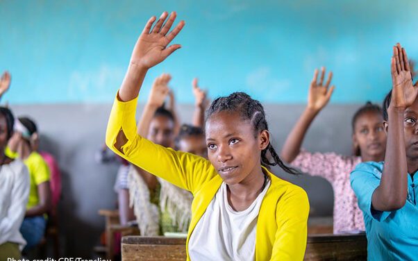 Female student lifts her hand in a classroom in Yirba Yanase Secondary School in Hawassa, Ethiopia.