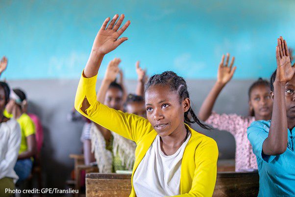 Female student lifts her hand in a classroom in Yirba Yanase Secondary School in Hawassa, Ethiopia.