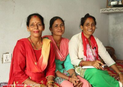 3 Nepali women - Community worker Maya with returnee migrants Bimala and Sumitra, Nepal.