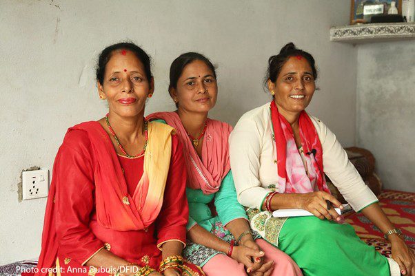 3 Nepali women - Community worker Maya with returnee migrants Bimala and Sumitra, Nepal.