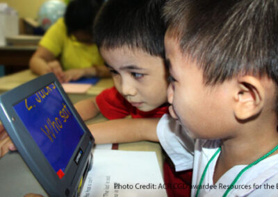 children with visual impairment look at an assistive screen