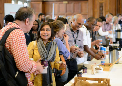 A group of people collecting coffee and chatting . Image from UKFIET Conference 2017