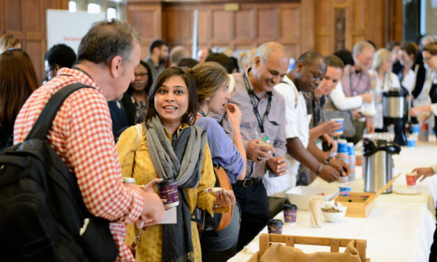 A group of people collecting coffee and chatting . Image from UKFIET Conference 2017