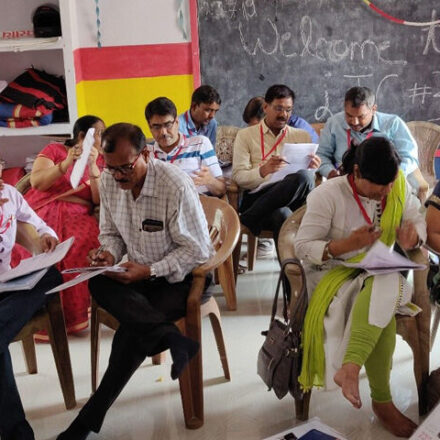 Photo of teachers in pairwork discussions at a recent workshop in India.
