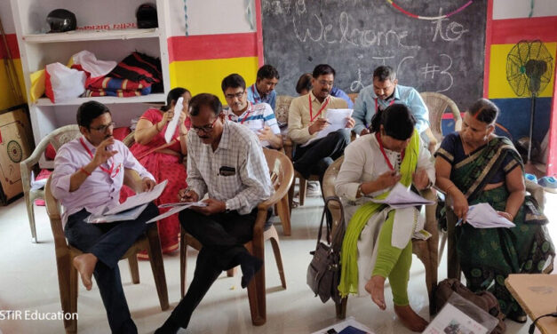 Photo of teachers in pairwork discussions at a recent workshop in India.