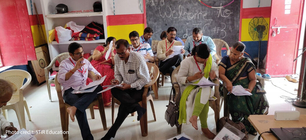 Photo of teachers in pairwork discussions at a recent workshop in India.