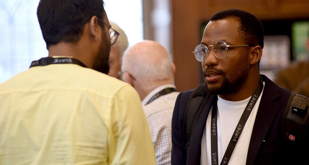 Daniel Hawkins Iddrisu chats to another conference participant during a coffee break.