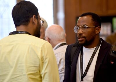 Daniel Hawkins Iddrisu chats to another conference participant during a coffee break.