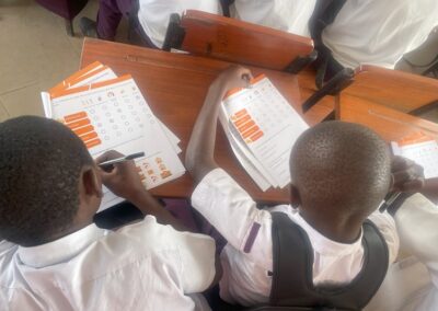 Students from Charambe Secondary School filling out comfort survey, Temeke District - Dar es Salaam, Tanzania.