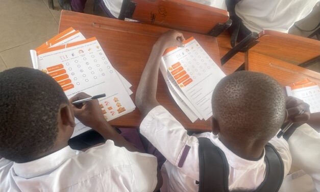 Students from Charambe Secondary School filling out comfort survey, Temeke District - Dar es Salaam, Tanzania.