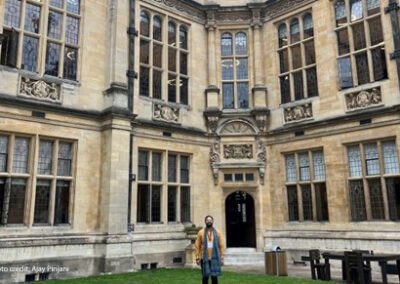 Ajay Pinjani, a 2023 UKFIET conference participant, stands in the quad at the Oxford Exam Schools.