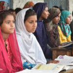 Adolescent girls sit at desks at the Siyani Sahelian Remedial Learning Center in Muzaffargarh Punjab, Pakistan.