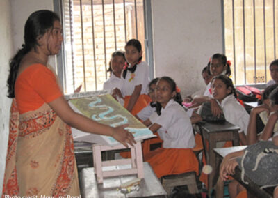 Demonstration of learning aid by a trainee teacher at school.