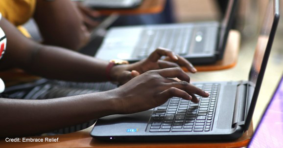 Hands type on a laptop (2019)