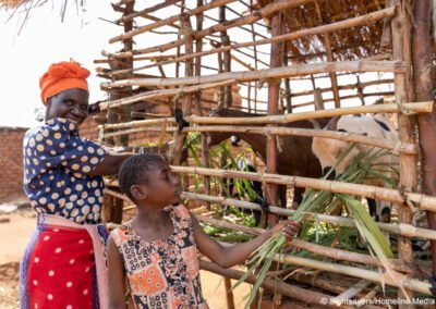 Shelista, who is deaf and attends an inclusive school, with her grandmother in Malawi.