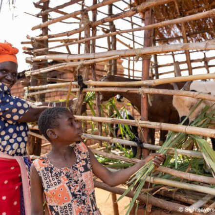 Shelista, who is deaf and attends an inclusive school, with her grandmother in Malawi.