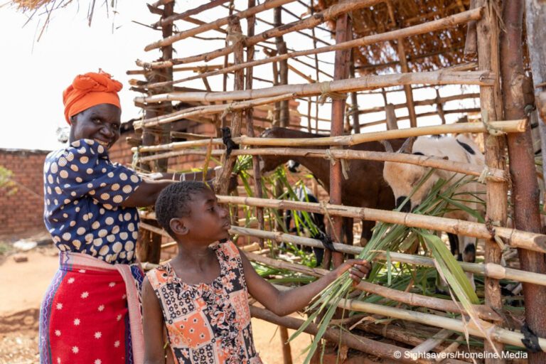 Shelista, who is deaf and attends an inclusive school, with her grandmother in Malawi.