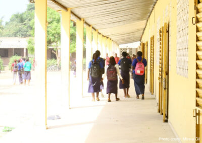 Students leaving class in a high school compound, Senegal.