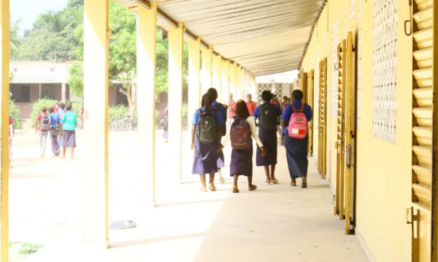 Students leaving class in a high school compound, Senegal.