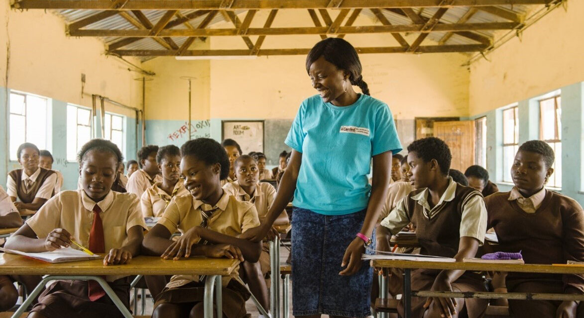 A female Learner Guide secondary school graduate goes back to school to mentor other girls, Zambia.