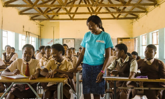 A female Learner Guide secondary school graduate goes back to school to mentor other girls, Zambia.