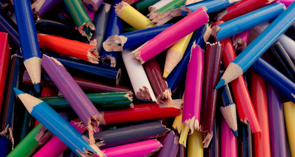 A pile of broken coloured pencils