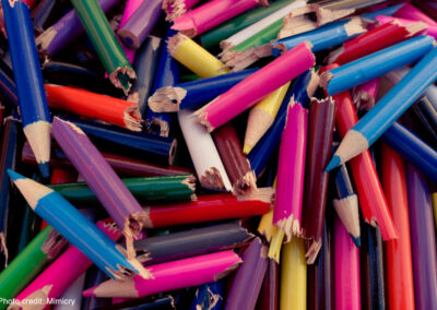 A pile of broken coloured pencils