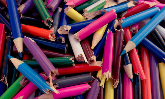 A pile of broken coloured pencils