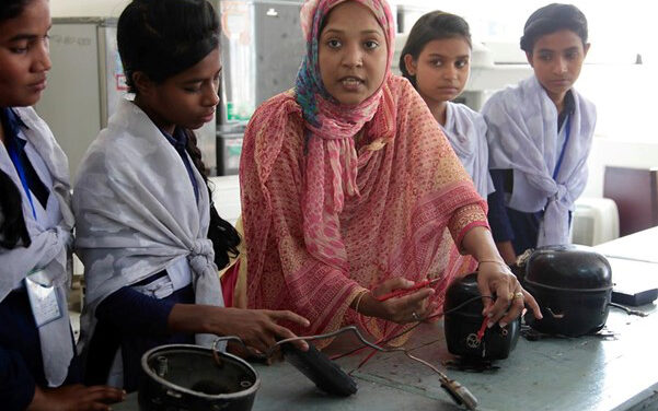 A Bangladeshi female teacher, Shirina Akter, instructing a glass of girls using electronic equipment at UCEP (Underprivileged Children’s Educational Programme) school in Dhaka, Bangladesh.