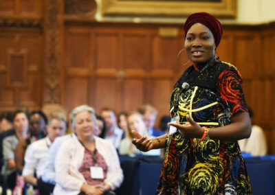 Basirat Razq Shuaib delivering her poem at UKFIET Conference 2023 in Oxford