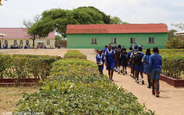 Students walk to class at Murape Primary School, Zimbabwe.